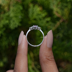Back View of Oval Cut Gemstone Engagement Ring In two fingers
