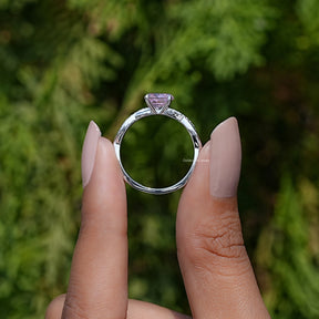 Back View of Pink Tourmaline Round Cut Gemstone Ring In two fingers