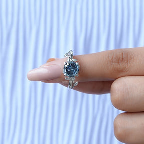 In finger front View of Blue Portuguese Cut Moissanite Ring In White Gold
