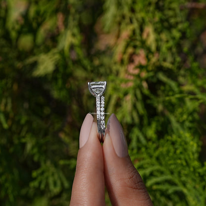 Side View A Princess Cut Lab  Diamond Ring in a two fingers
