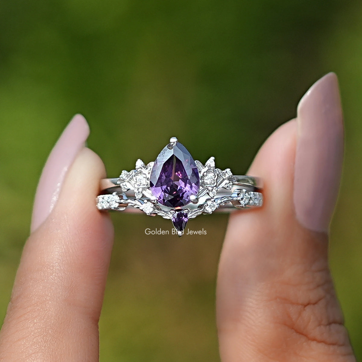 Front View of Purple Amethyst Pear Gemstone Ring Set In two Fingers