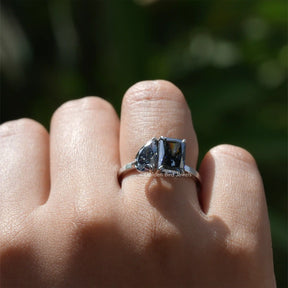 [This toi moi moissanite ring crafted with radiant and pear cut stones]