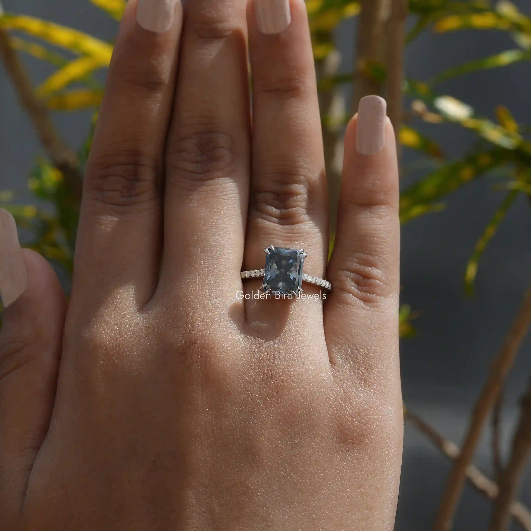 [Grey radiant cut moissanite hidden halo ring with accent stones]