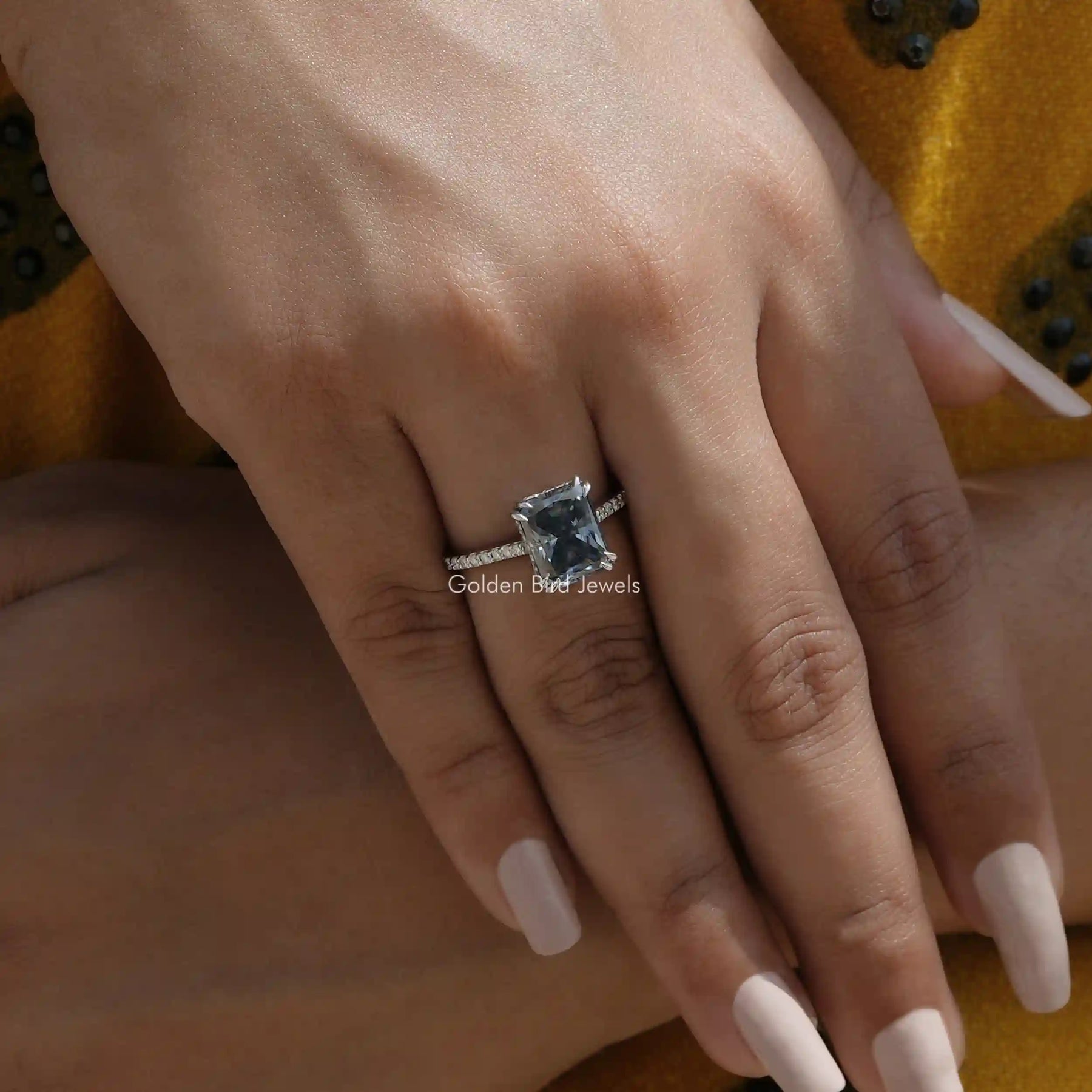[This moissanite hidden haloring made of grey radiant cut stone in white gold]