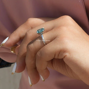 [Slightly folded finger side view of radiant cut solitaire engagement ring in 14k white gold]-[Golden Bird Jewels]