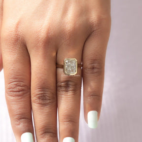 Close-Up View of Radiant Cut Diamond Bezel Set Solitaire Ring In Yellow Gold