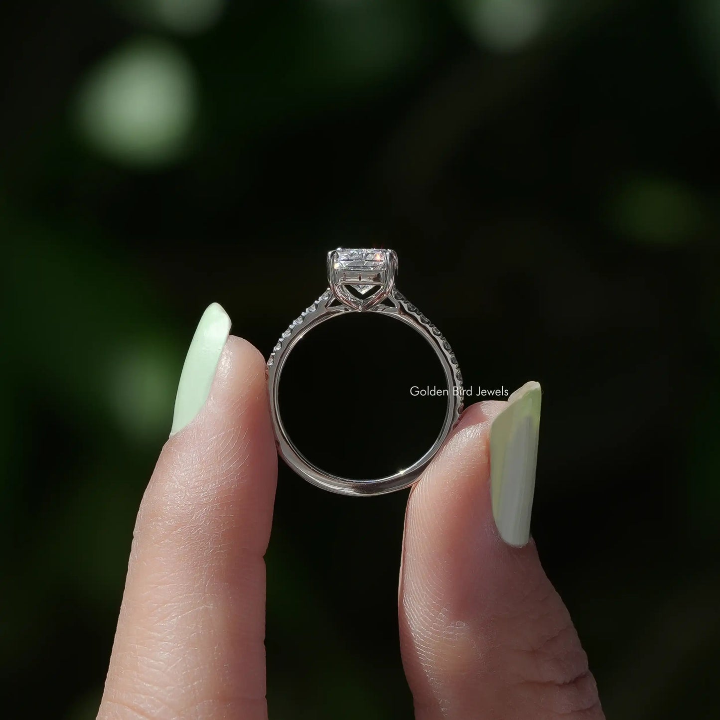 Back View of Radiant Cut Solitaire Accent Diamond Engagement Ring In two fingers