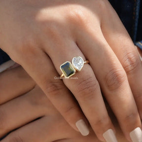 [Cross finger front view of two stone moissanite ring made of yellow gold]