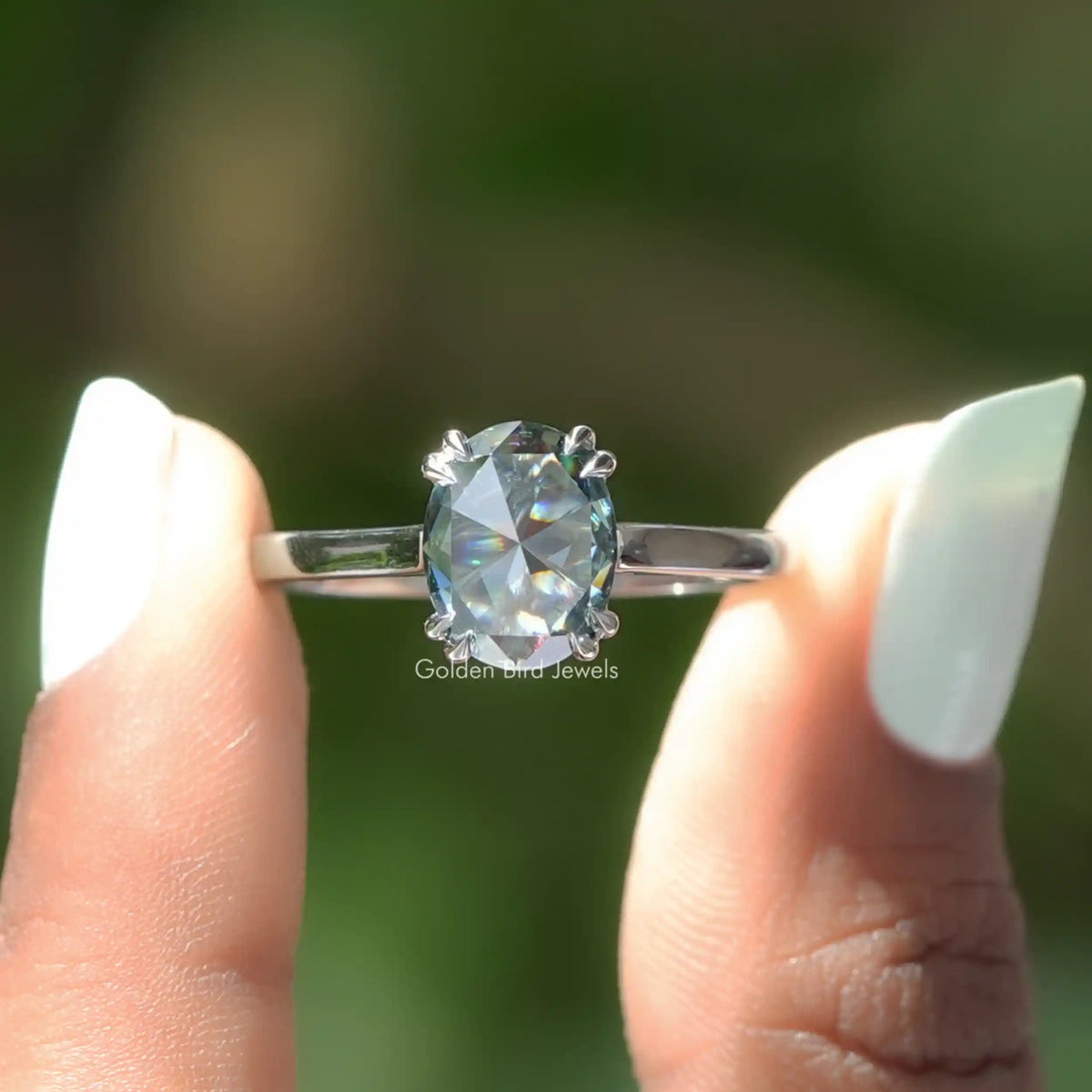 Front View of Rose Cut Oval Moissanite Solitaire Engagement Ring In two Fingers