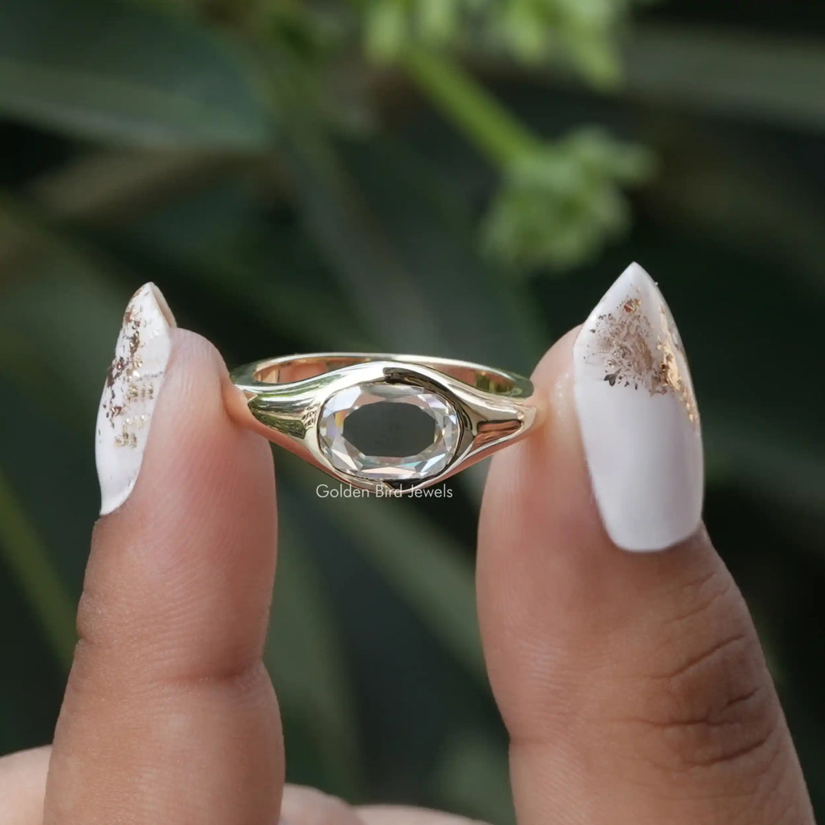 [In two finger front view of rose cut oval moissanite ring]-[Golden Bird Jewels]