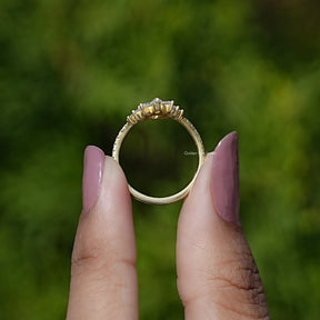 Back View of Round Moissanite Curved Engagement Ring In two fingers
