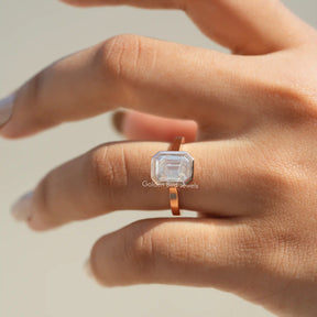 View of Moissanite Emerald Cut Engagement Ring In Finger