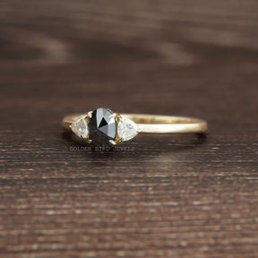 View of Black Oval Cut Moissanite Three Stone Ring In Yellow Gold