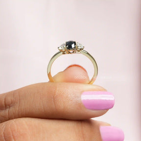 Back View of Trillion And Oval Cut Moissanite Ring In two fingers