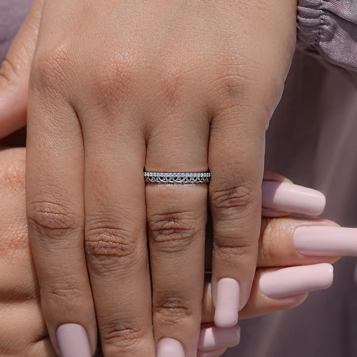 Moissanite stacking band with pavé stones in a thin silver ring