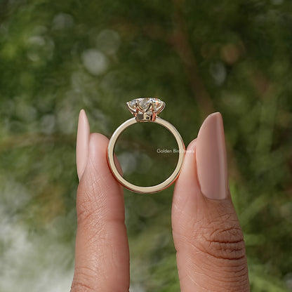 Moissanite solitaire ring viewed from front with prong-set round center stone