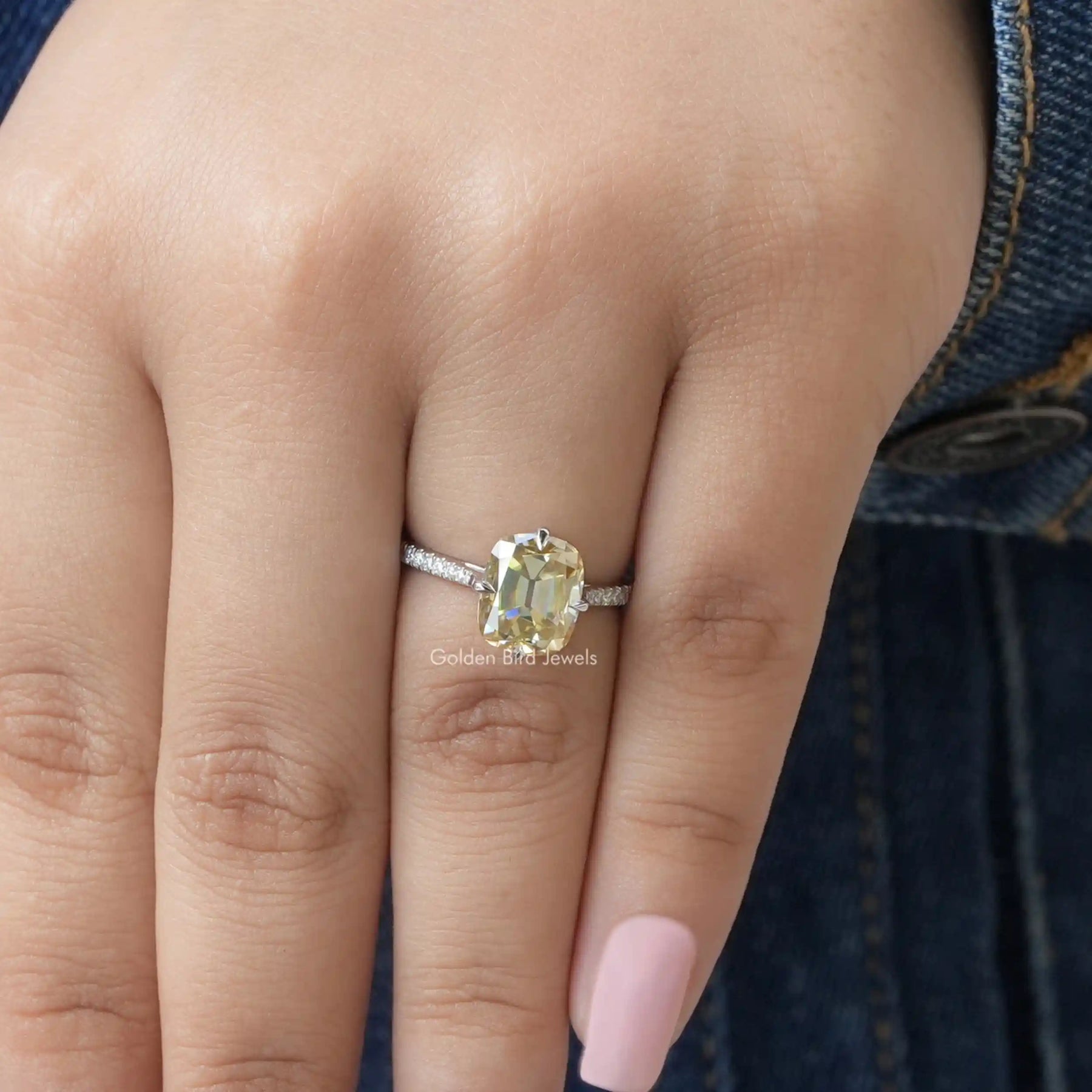 [In finger front view of yellow cushion cut moissanite engagement ring]-[Golden Bird Jewels]