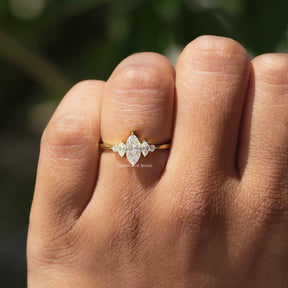 Detailed View Of Marquise And Round Cut Moissanite Ring In Yellow Gold