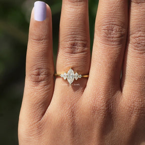 View of Marquise And Round Cut Engagement Ring In finger