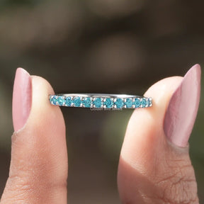 Front View of Round Cut Blue Topaz Gemstone Half Eternity Band In two Fingers