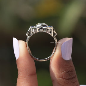 Back View of Round Cut Bezel Set Moissanite Ring In two fingers