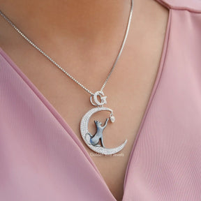 In neck view of round cut cat moon moissanite halo pendant 
