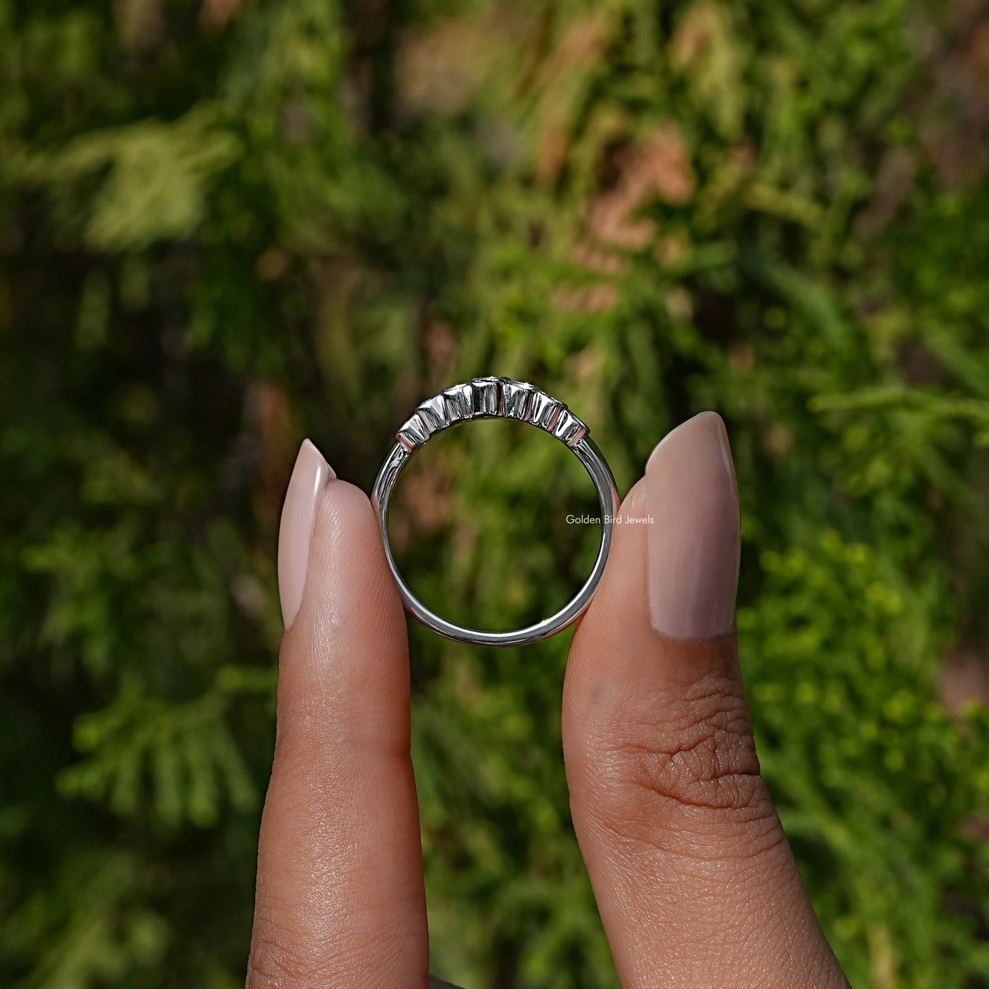 In finger front view of halo Round Diamond engagement ring
