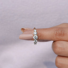 In finger front View of Round Cut Lab Diamond Accent Ring In Yellow Gold