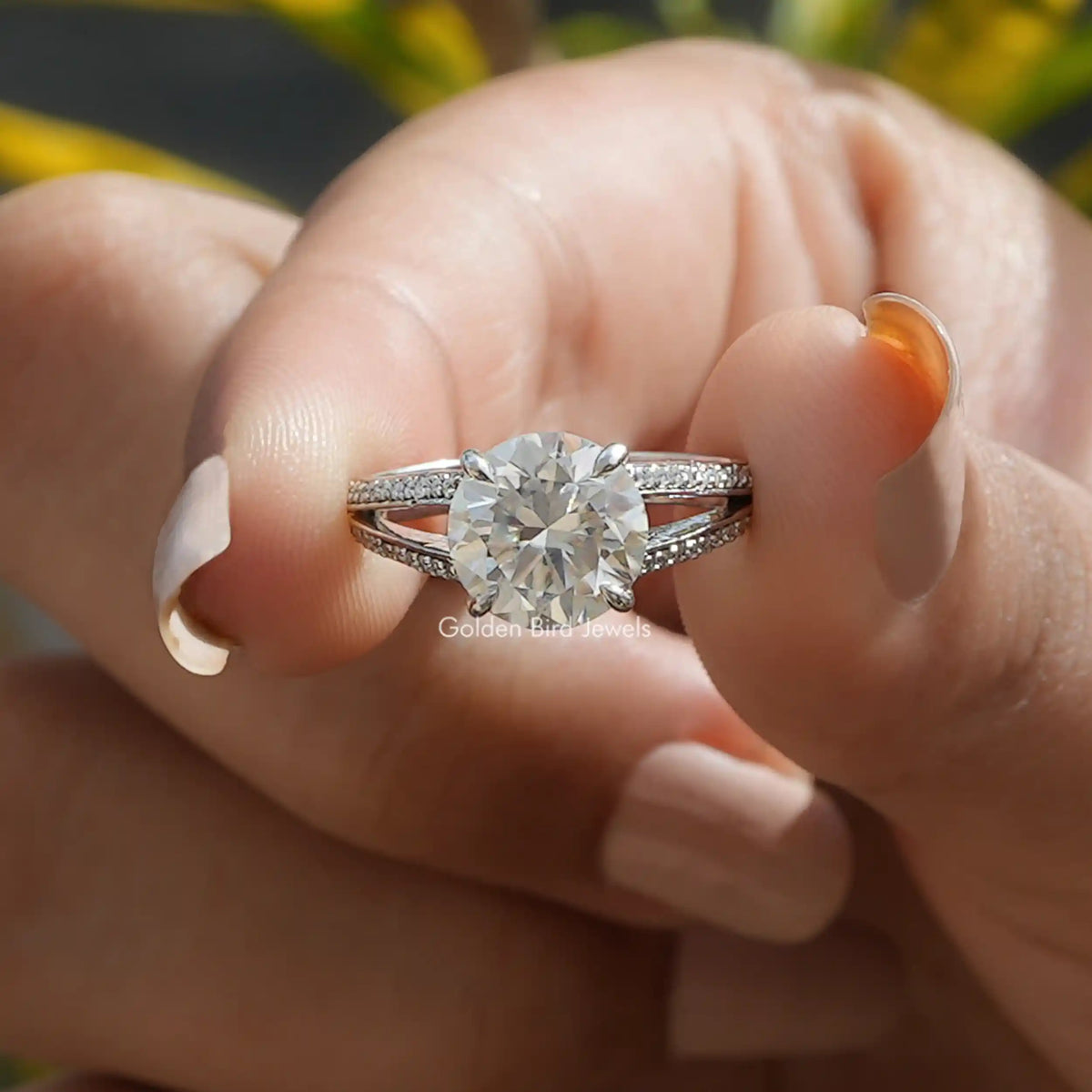 Front View of Round cut moissanite accent stone engagement ring In Two Fingers