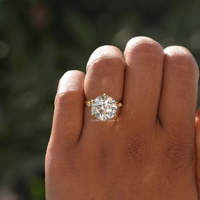 Close-Up View of Round Cut Moissanite Ring In Yellow Gold