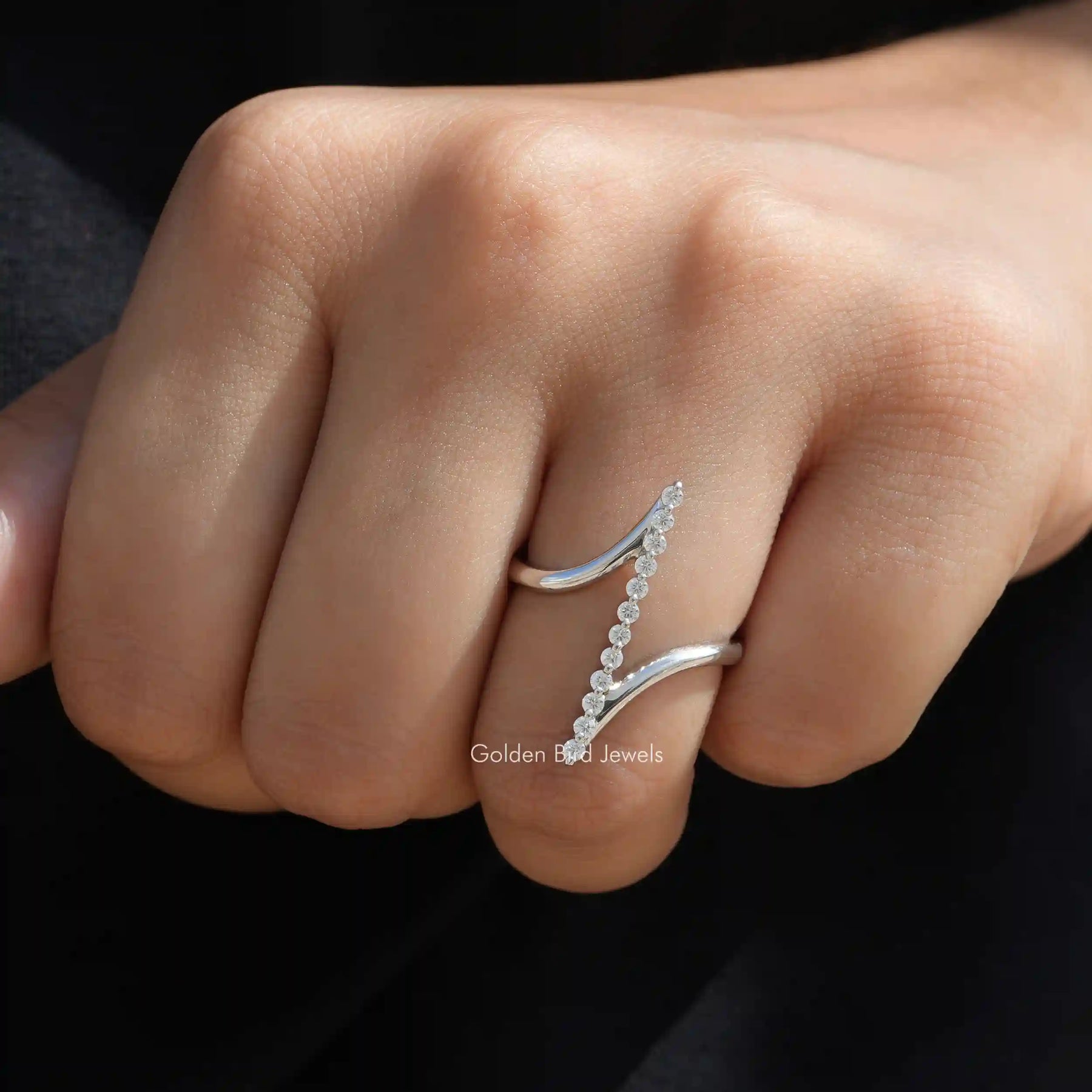 [This ring crafted with vertical bar style design set in round cut moissanite stones]