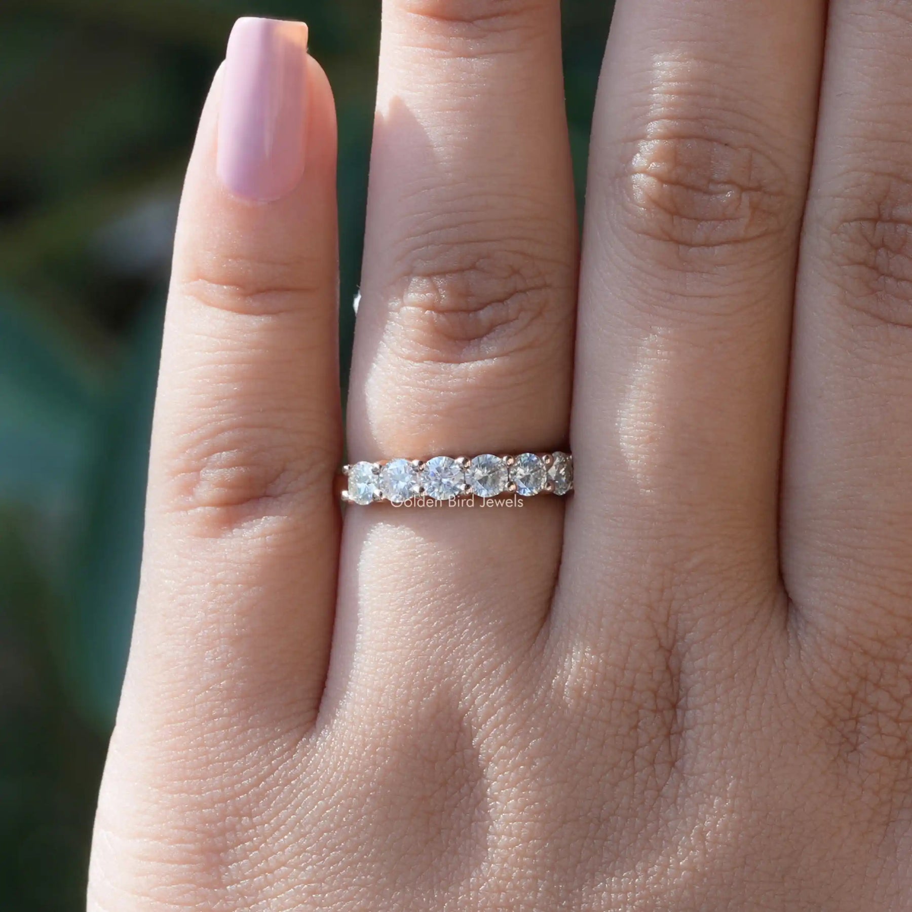 [In finger front view of round cut moissanite anniversary band]-[Golden Bird Jewels]