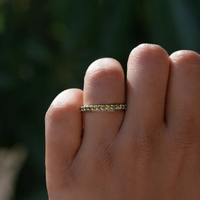 View of Green Round Eternity Band in prongs setting