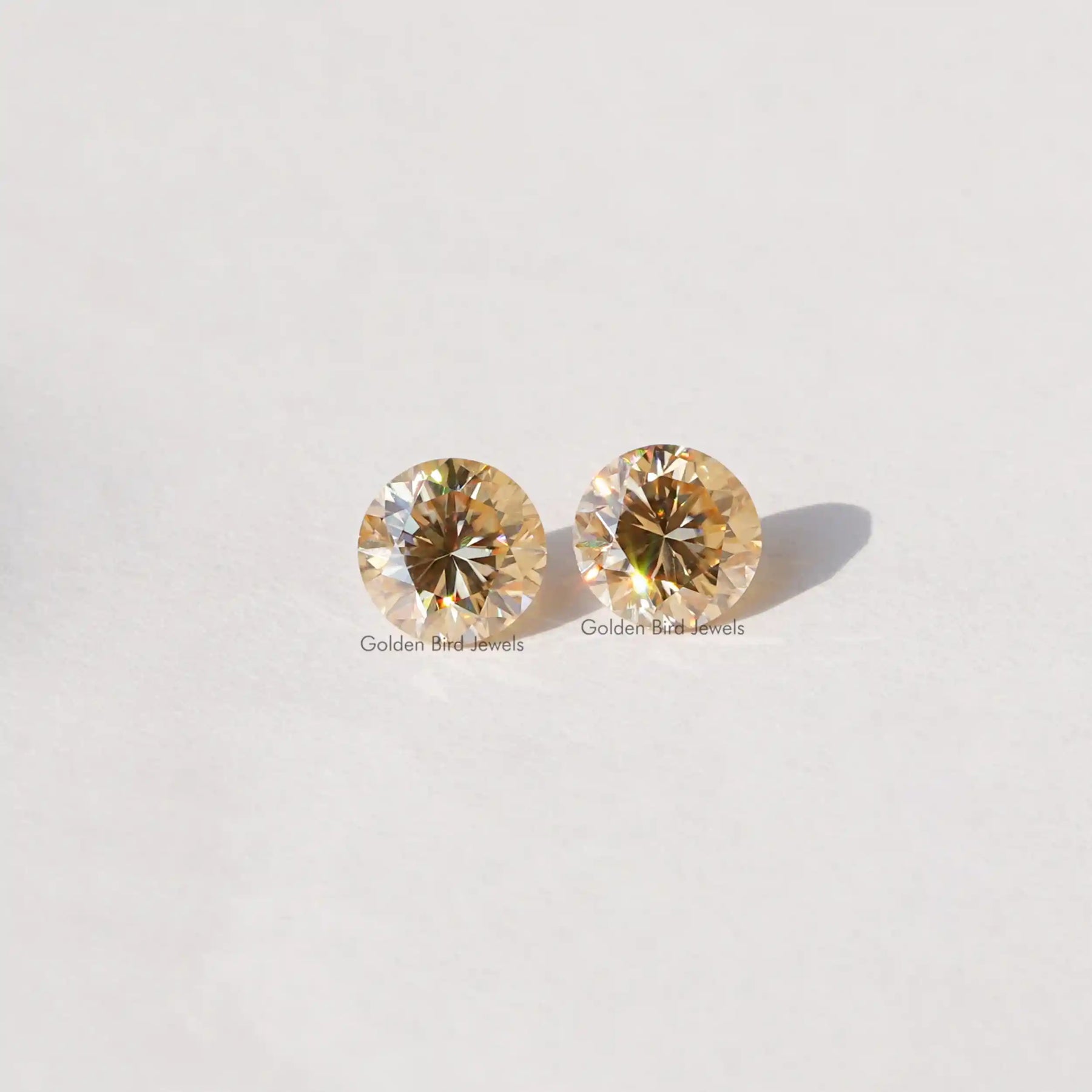 [Front view of round cut moissanite loose stones made of champagne color]-[Golden Bird Jewels]