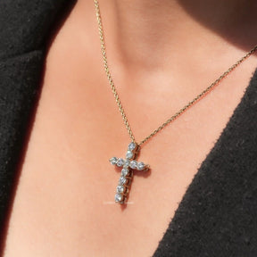 Side view of cross pendant In yellow Gold