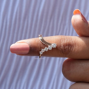In finger front View of Round Cut V Shaped Moissanite Ring In Yellow Gold
