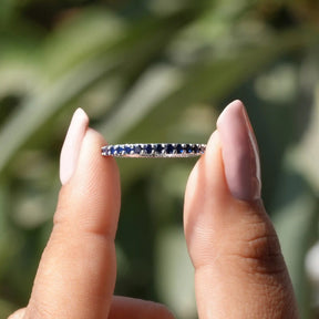 View of Round Sapphire Gemstone Eternity Band In White Gold