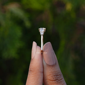Side View of Shield And Round Cut  Lab Diamond Ring In two fingers