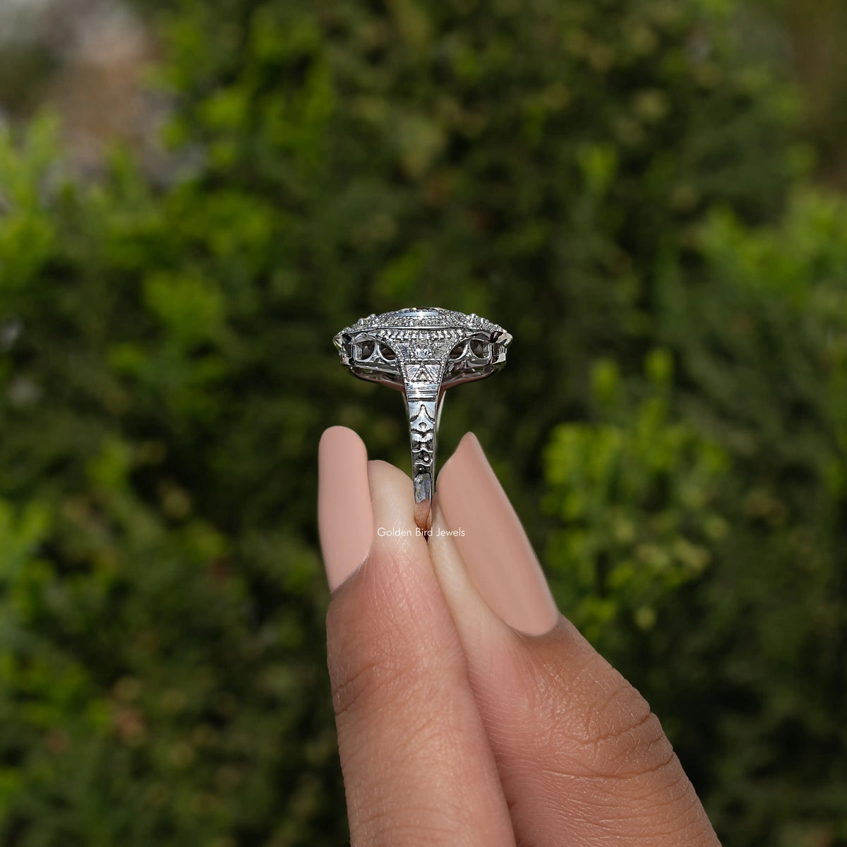 Sterling silver round moissanite ring underside view with prongs and engraved band