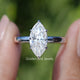 Front view of Red Marquise Cut Moissanite Hidden Halo Wedding Ring Set in two fingers 