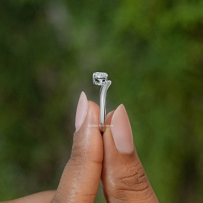 Pear-cut moissanite solitaire engagement ring side view on finger