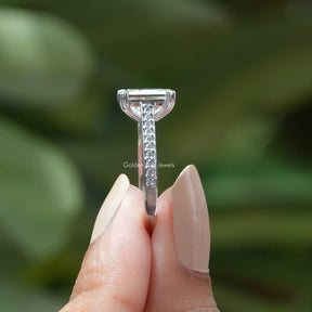 [In two finger side view of solitaire moissanite princess cut ring set in side round cut stones]-[Golden Bird  Jewels]