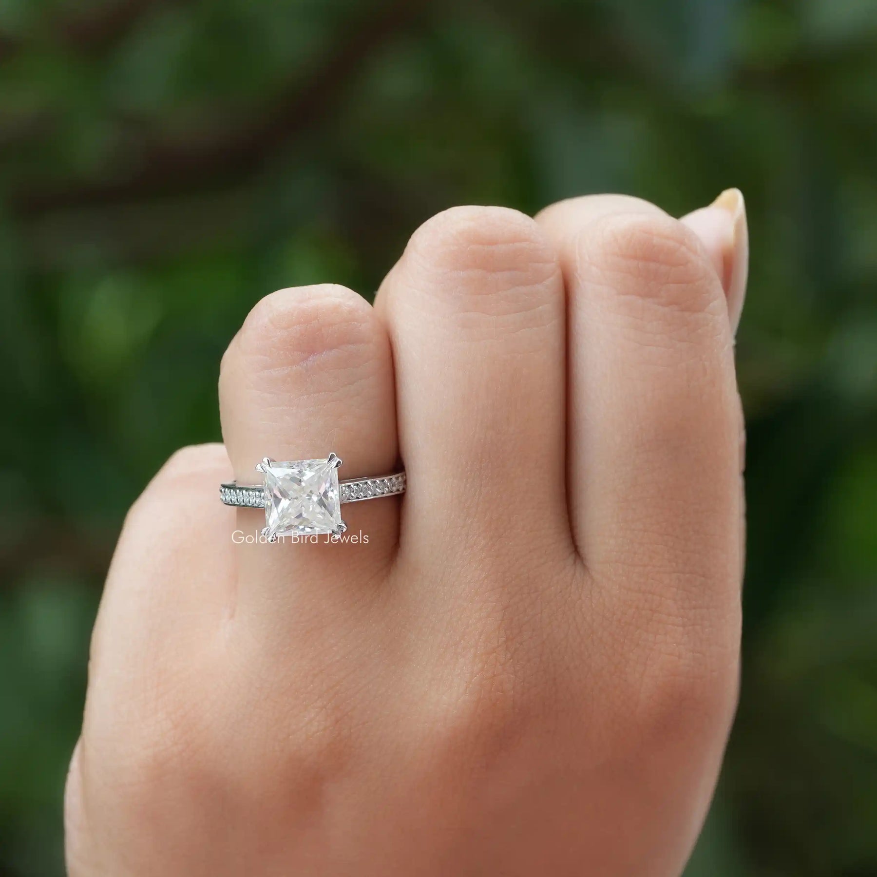 [In finger front view of moissanite engagement ring made of princess cut stone]-[Golden Bird  Jewels]