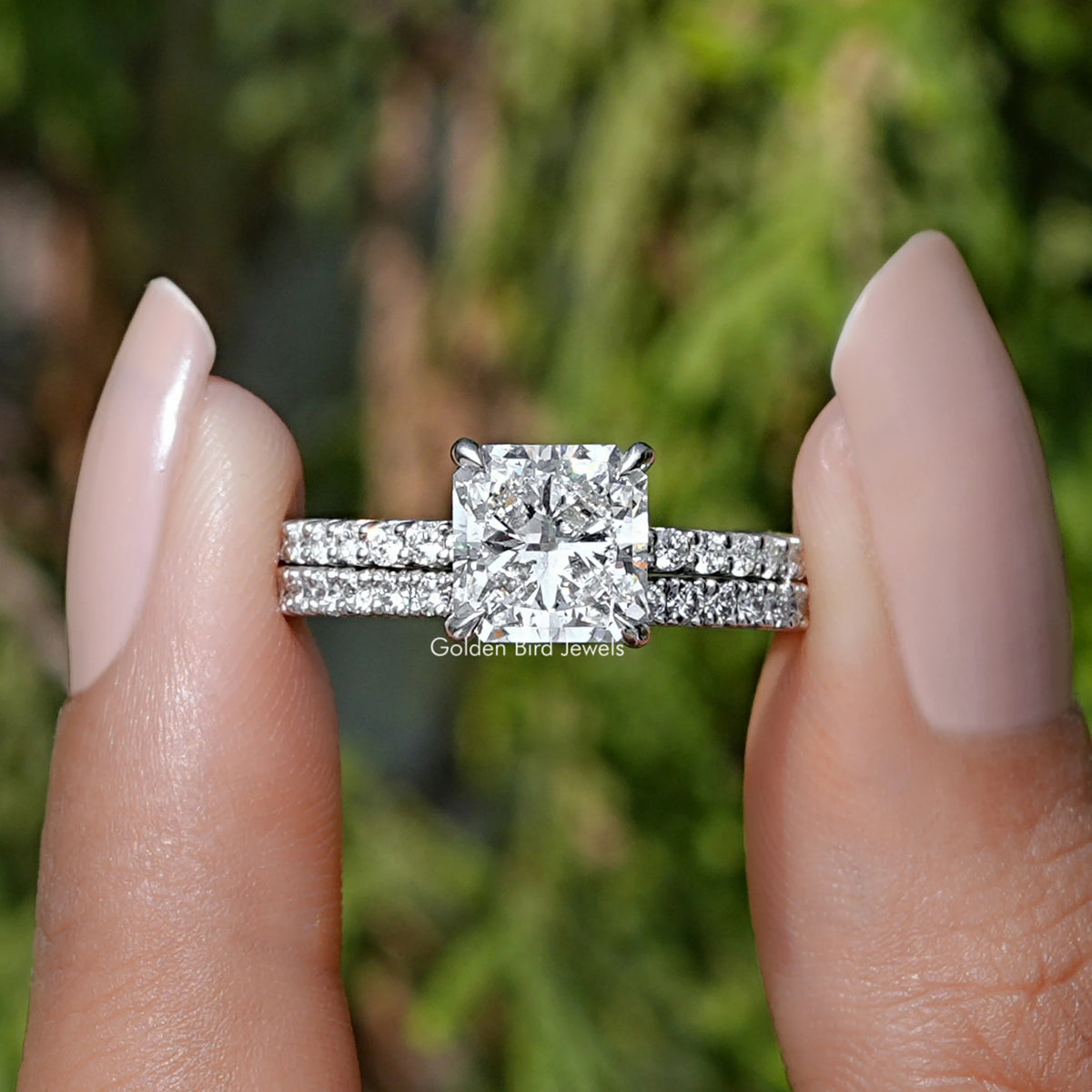 Square Radiant Cut Lab Diamond Bridal Ring held between two fingers
