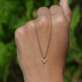 In Hand Holding the Round Cut Diamond Pave Set Pendant