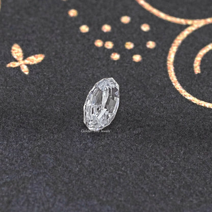 Loose lab-grown oval diamond seen from the side, step-cut faceting