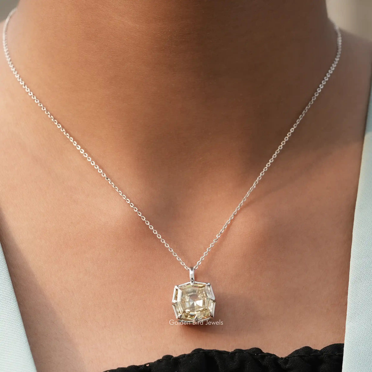 View of colorless cushion cut moissanite pendant 