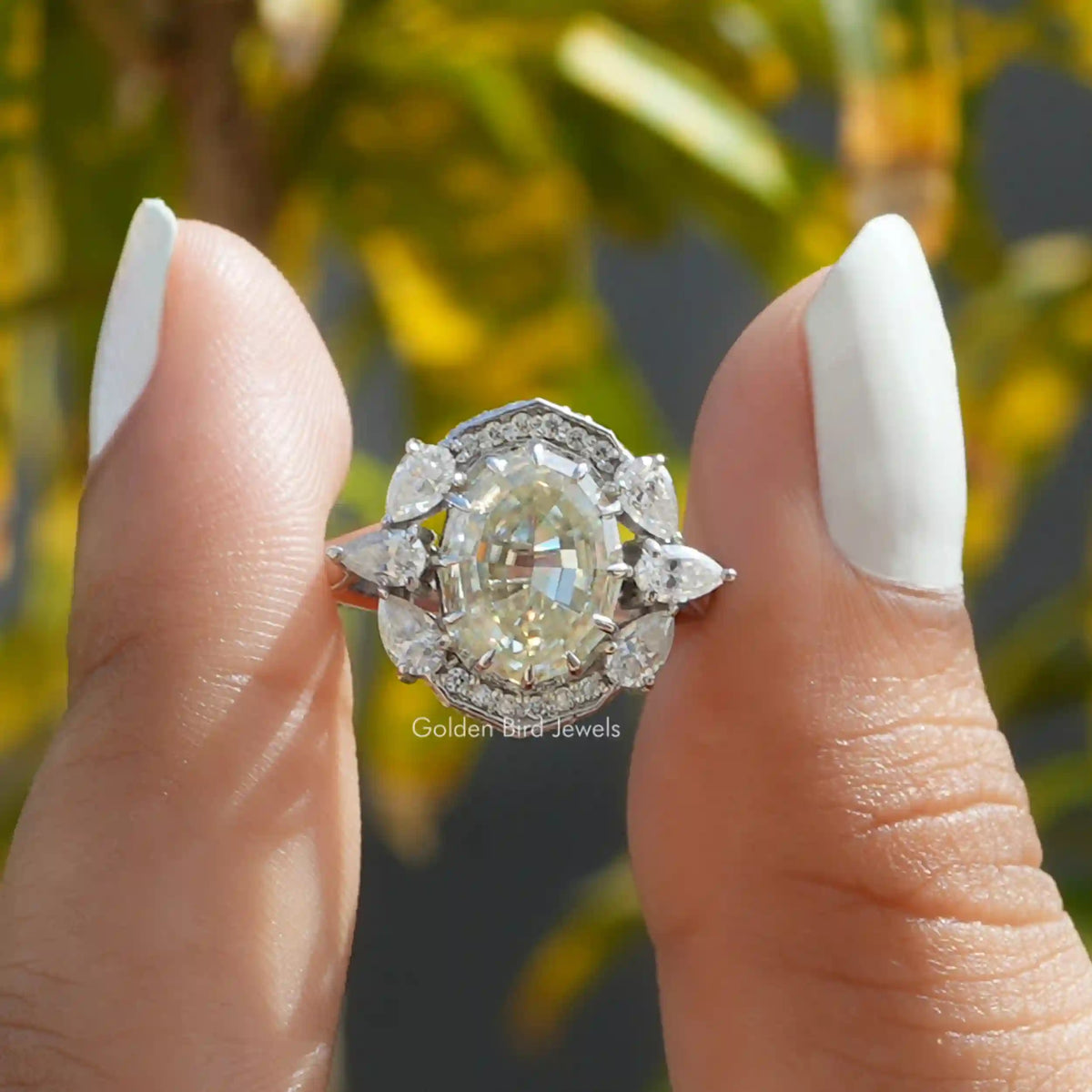 Front View of Step Cut Oval Halo Moissanite Vintage Ring In two Fingers