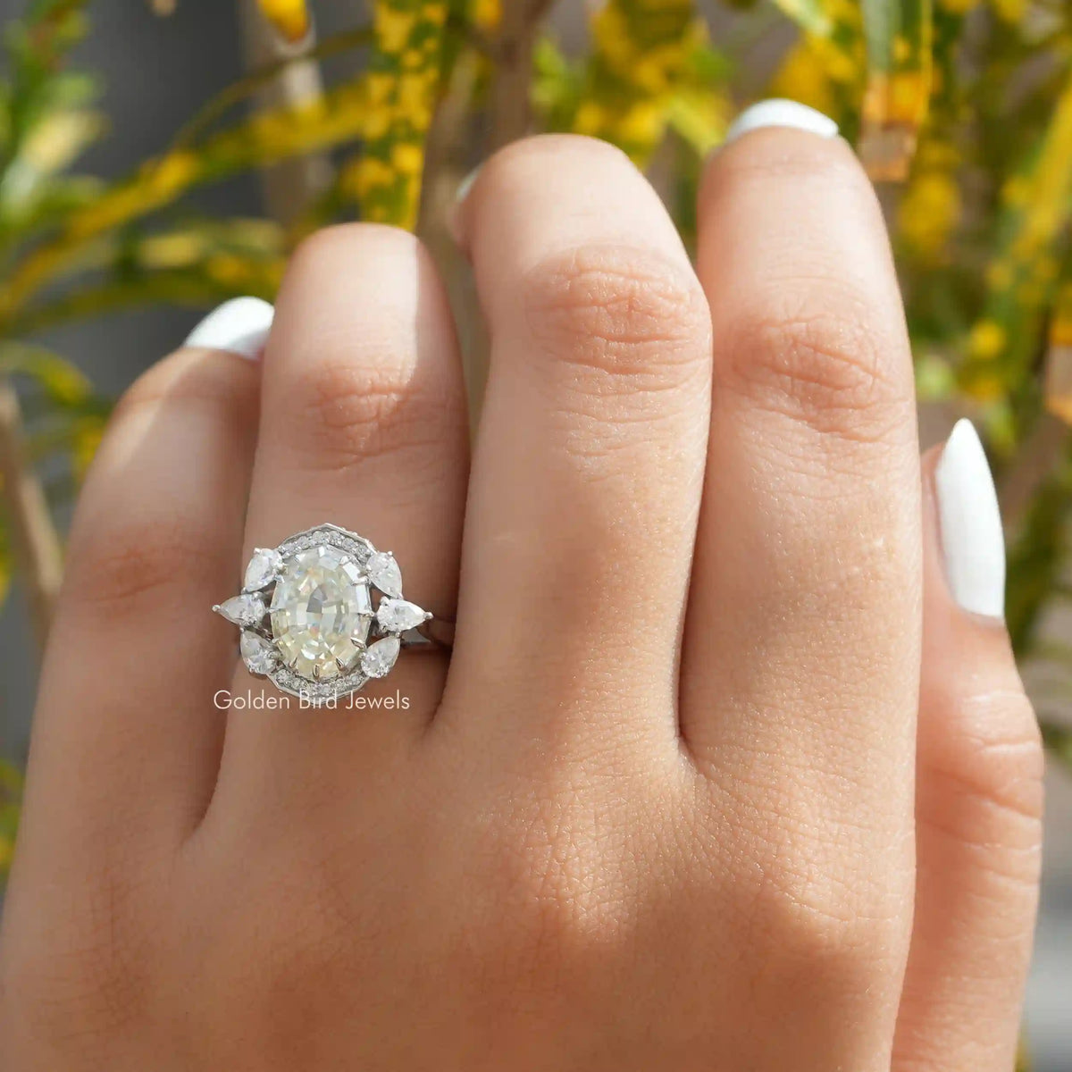 View of Moissanite Step Cut Oval Halo Vintage Ring In Finger