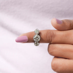 In finger front View of Round Cut three Stone Moissanite Ring